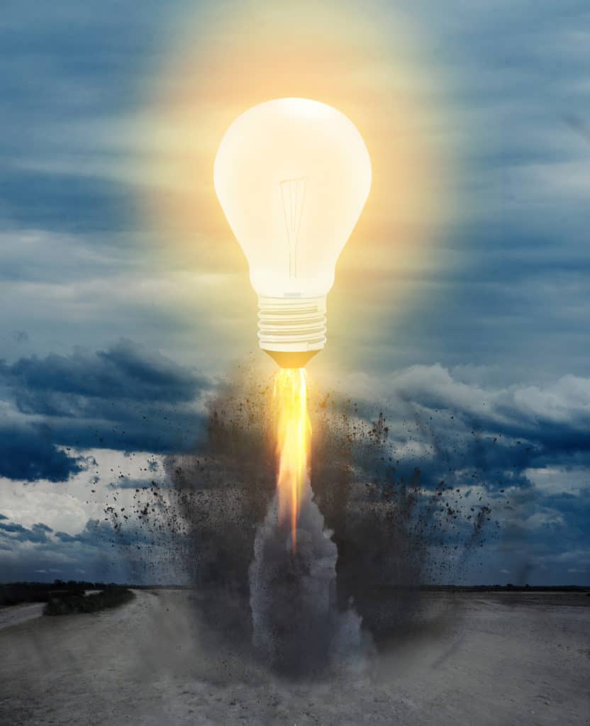 picture of a lit lightbulb taking off from the ground like a rocket on the small business marketing consultant website
