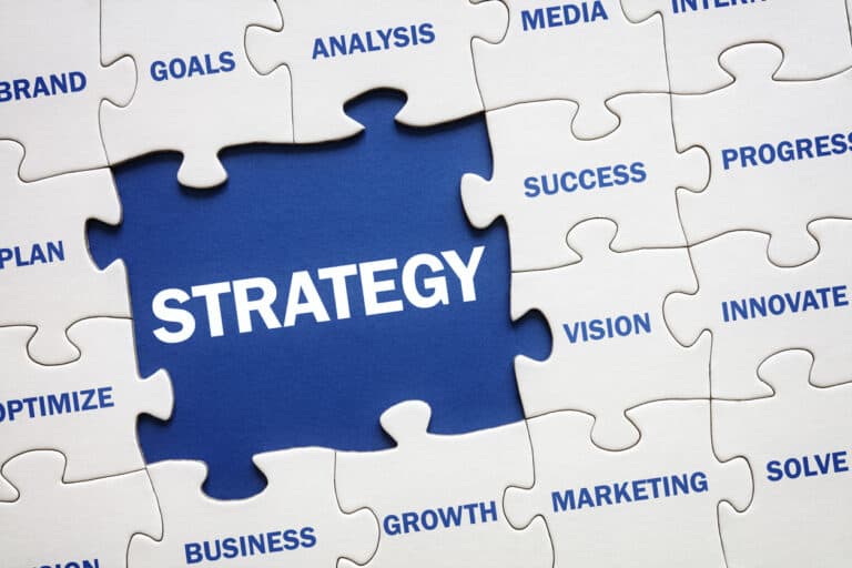 Missing piece of a jigsaw puzzle labelled Strategy in an article about why marketing strategy is important.